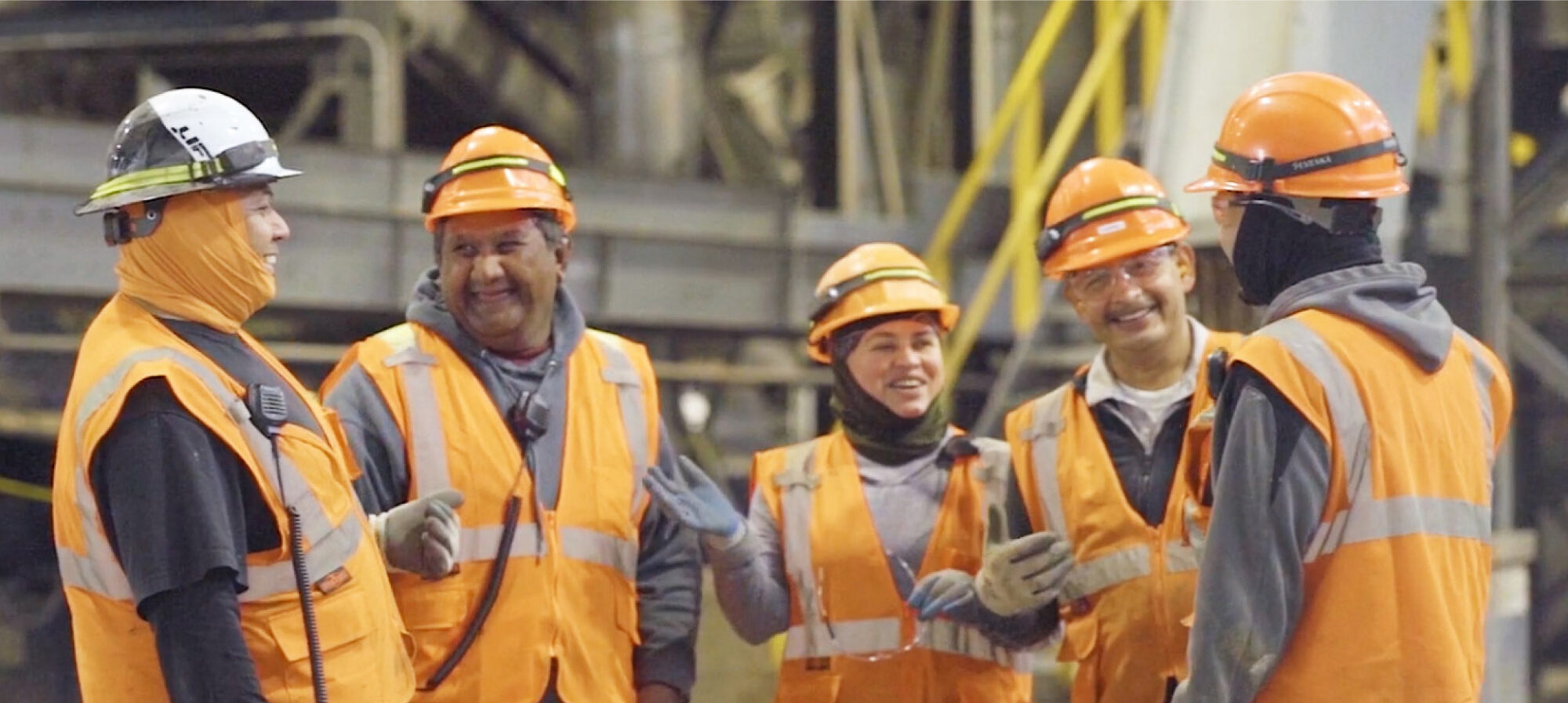 factory workers safety vests hats