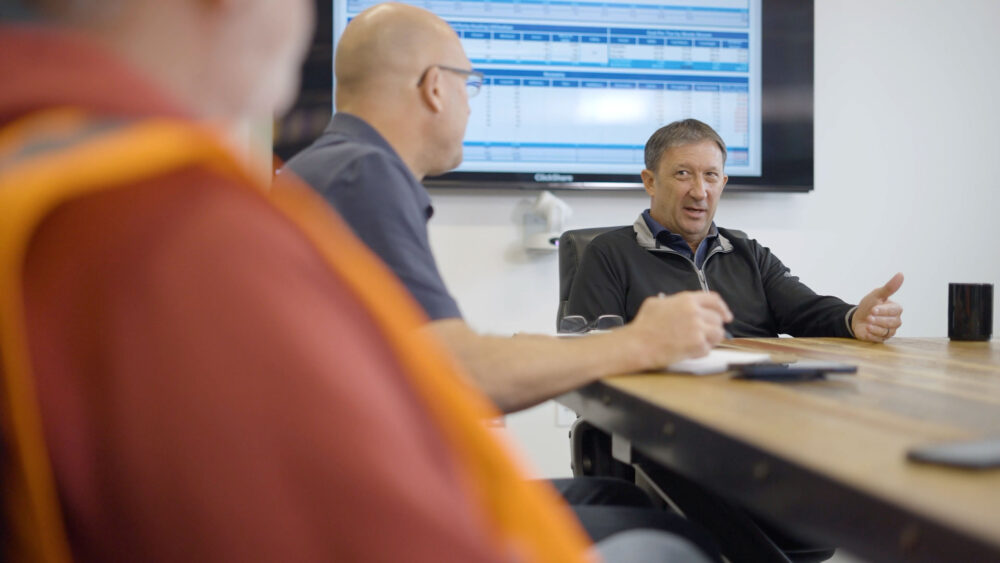 resource boardroom meeting discussing innovative waste management ideas